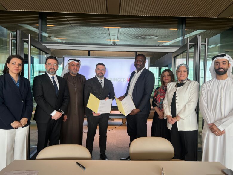 Signing ceremony with multiple participants.